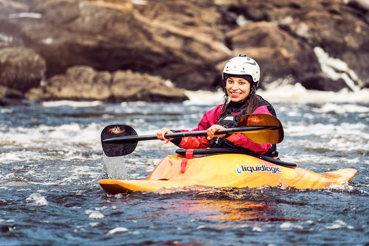 woman in a whitewater kayak