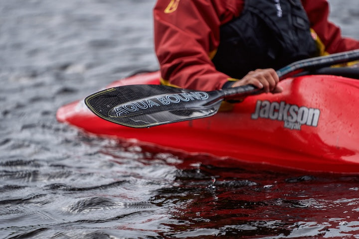 whitewater kayaker uses Aqua Bound's Aerial Carbon kayak paddle