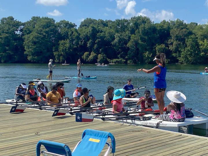 A group of women in rowing boats