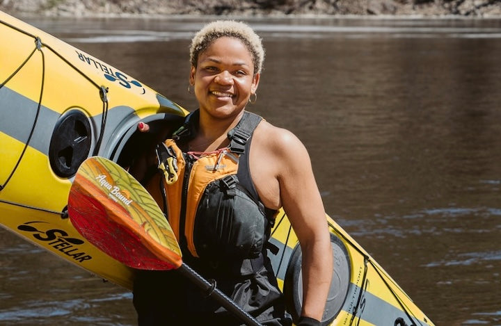 Devin Brown with her kayak and Aqua Bound paddle