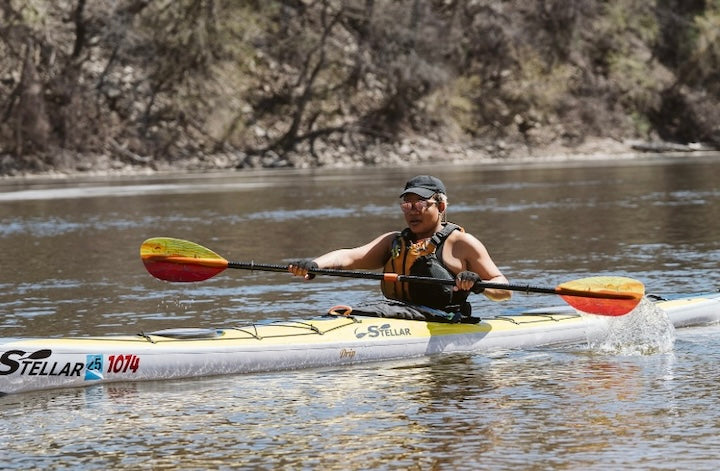 Devin Brown kayaks on the Mississippi River in Minneapolis, early spring