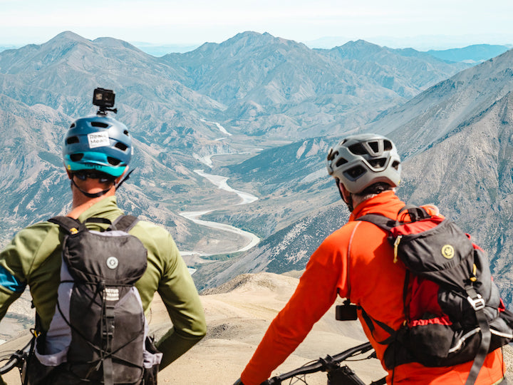 two bikers prepare for descent from the summit of Dillon Cone