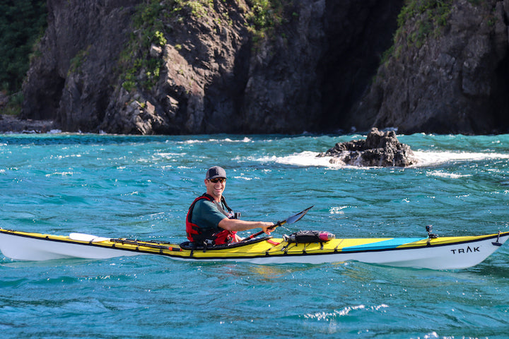 Ken Whiting kayaks Dominica waters - so blue!