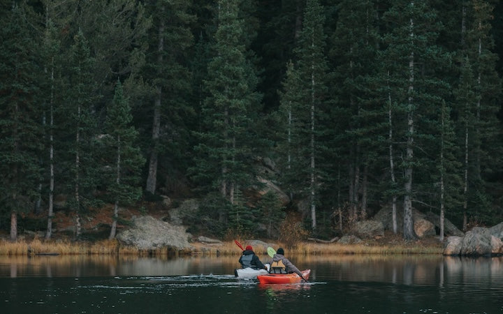 2 kayakers on a wilderness lake