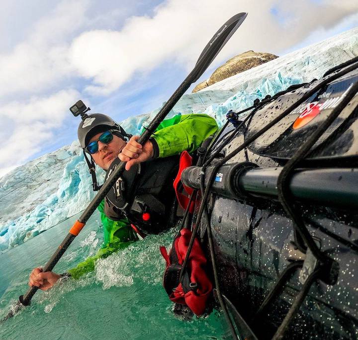 kayaker filming his paddle trip via gopro