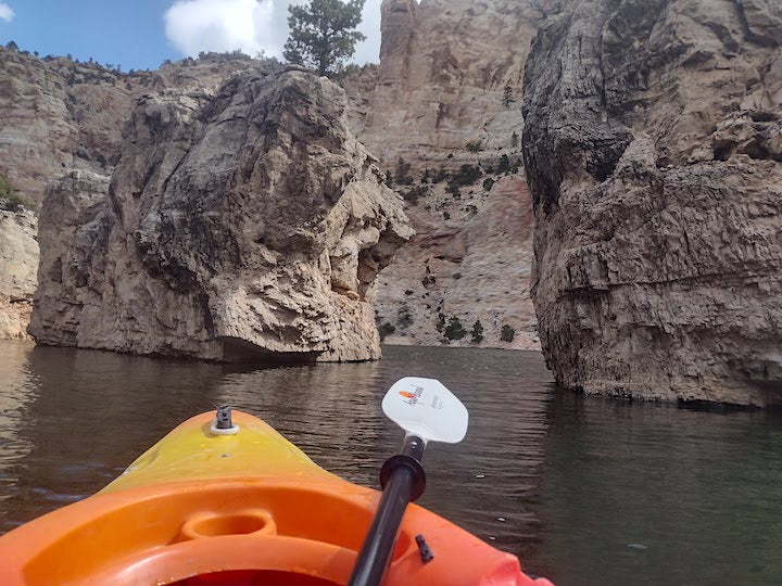 kayaking around a group of small isles in the canyon
