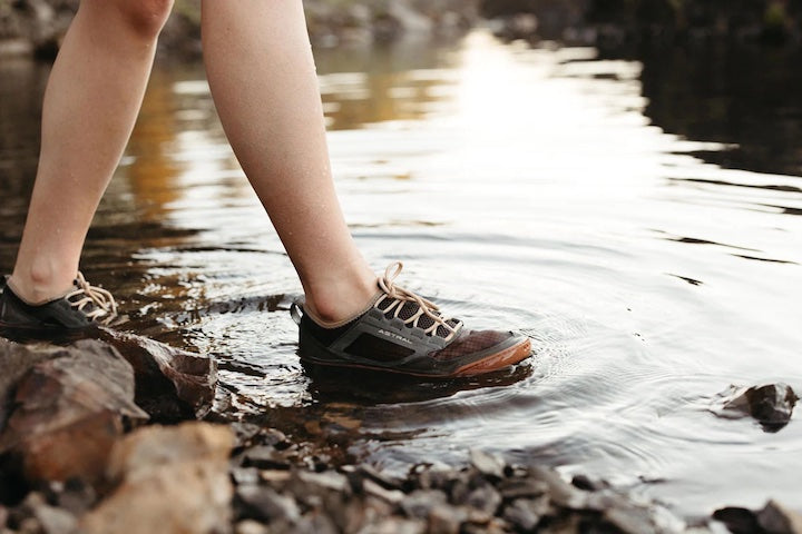 lower legs of a person wearing Astral's Loyak AC water shoes