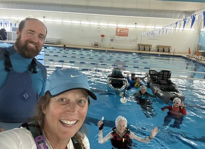 Will Seeley and his team at a kayak indoor pool class