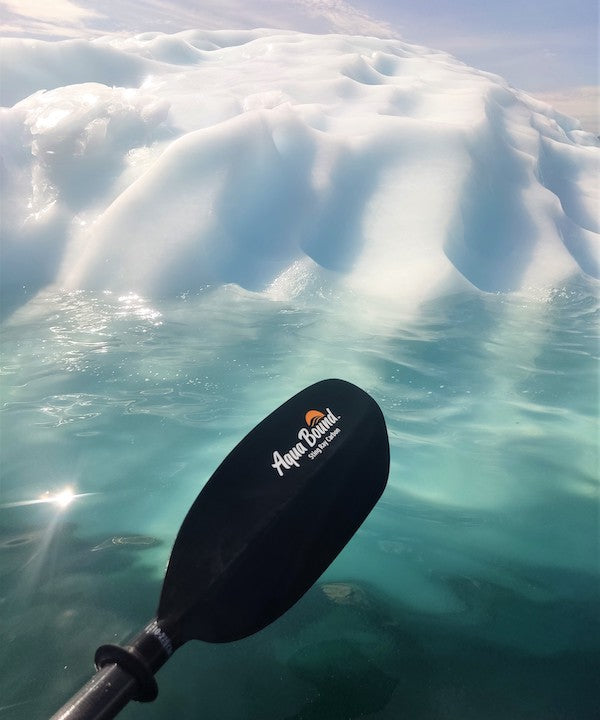 Aqua Bound paddle next to an iceberg