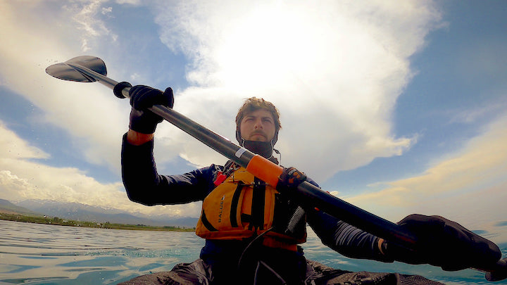 Hugo Desrosiers paddling his kayak on Lake Issyk-Kul