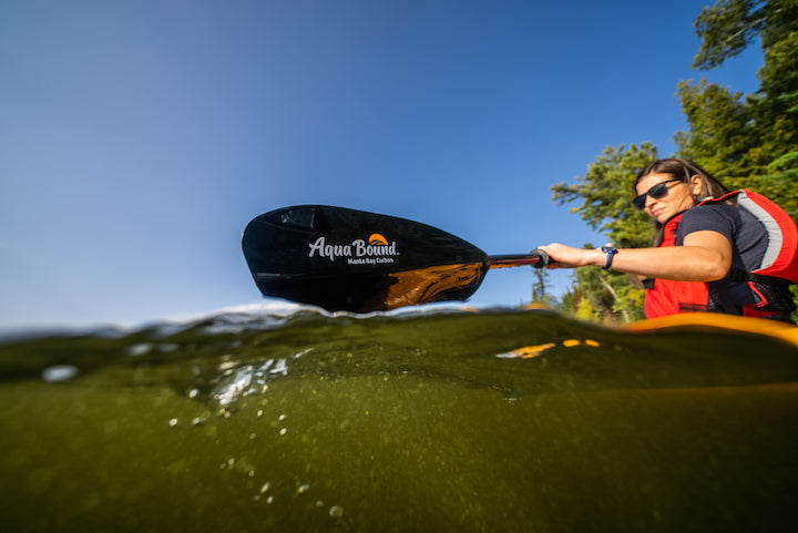 woman kayaking with Aqua Bound's Manta Ray Carbon paddle