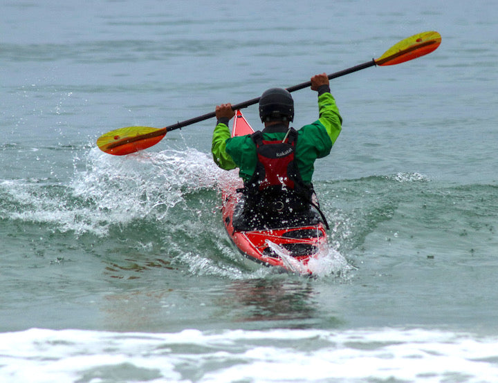 Jalle Stjernberg hits a wave in his sea kayak