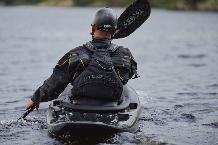 back view of a whitewater kayaker using Aqua Bound's Aerial Carbon paddle