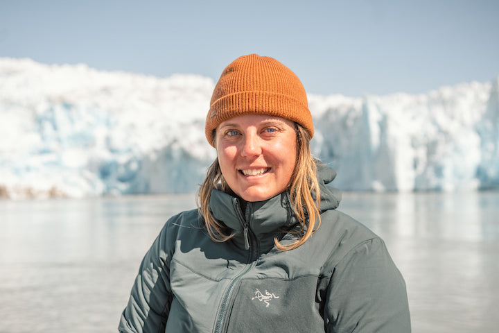 Kate Wright headshot, Greenland glacier in background