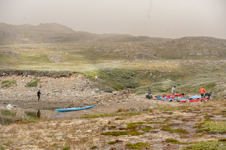 the crew getting ready to portage gear and kayaks in Greenland