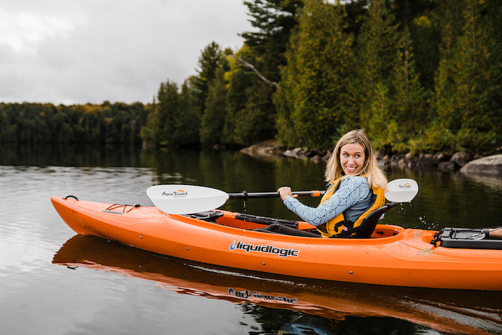 woman in open-cockpit rec kayak on a lake