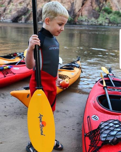 young boy ready to kayak