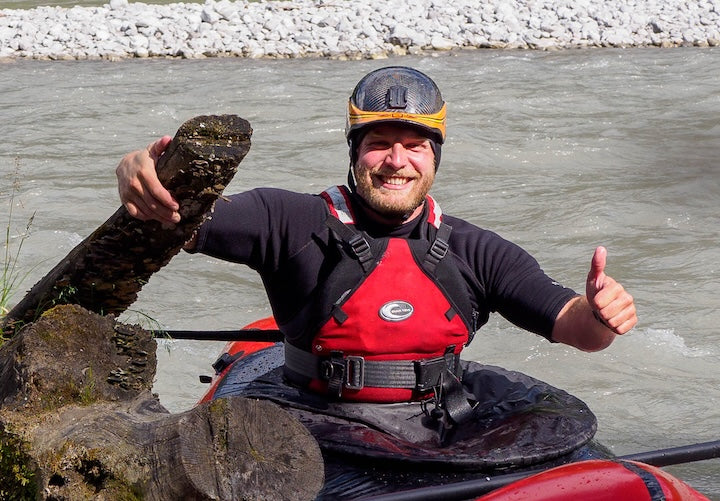 Sebastian Schmidt, owner of Land Water Adventures, in his packraft on the river