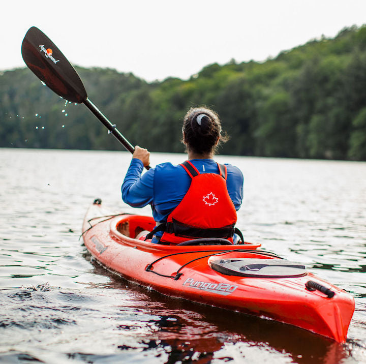 kayaker with aqua bound paddle