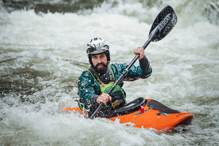 Mitch Sheridan in his whitewater kayak with Aqua Bound's Aerial paddle