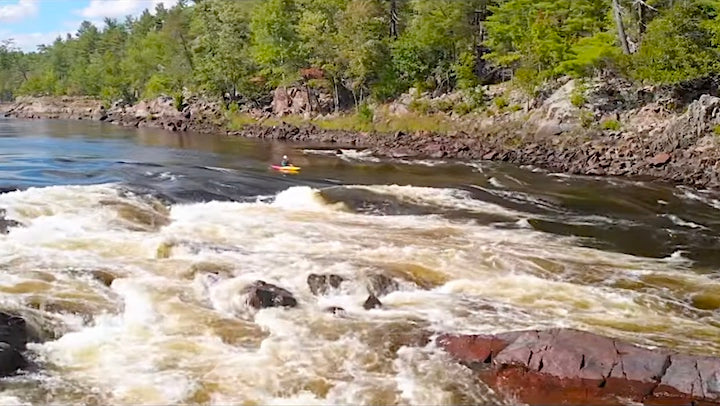 whitewater kayaker on big rapids on the Ottawa River