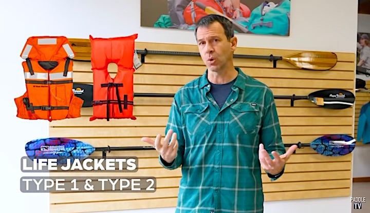 Ken Whiting talks with samples of type 1 and 2 life jackets on-screen