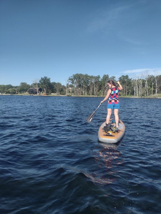 woman on a SUP on a lake, original photo