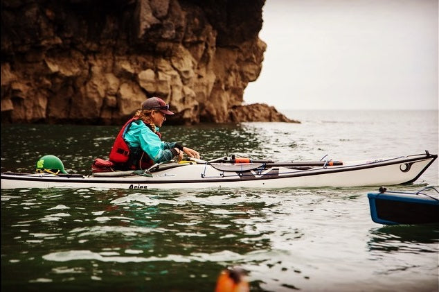 Rachel Bott in her sea kayak off the coast of Wales