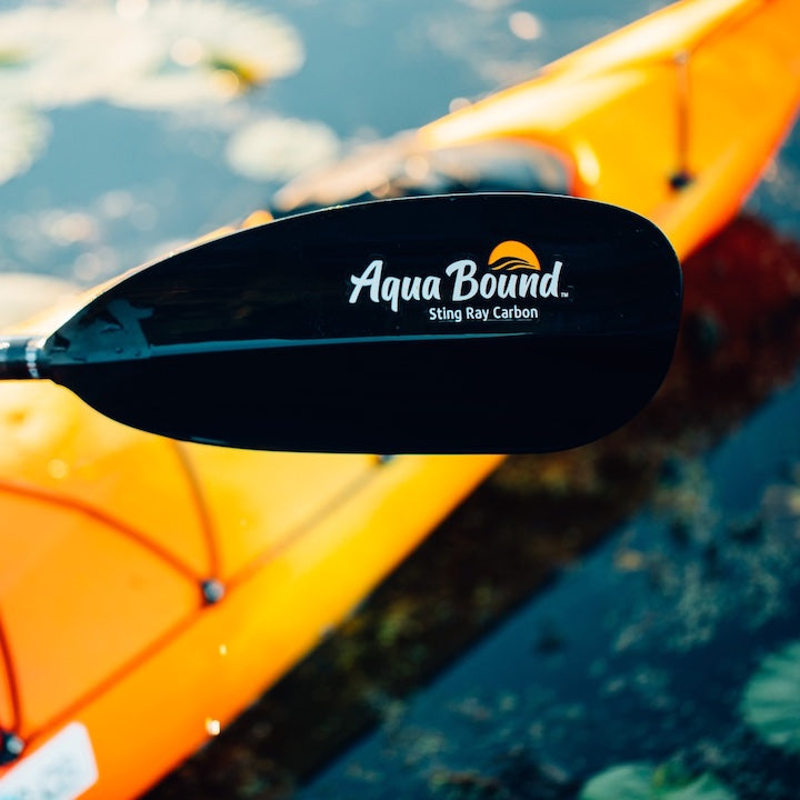 Aqua Bound's Sting Ray Carbon paddle, with kayak on the water