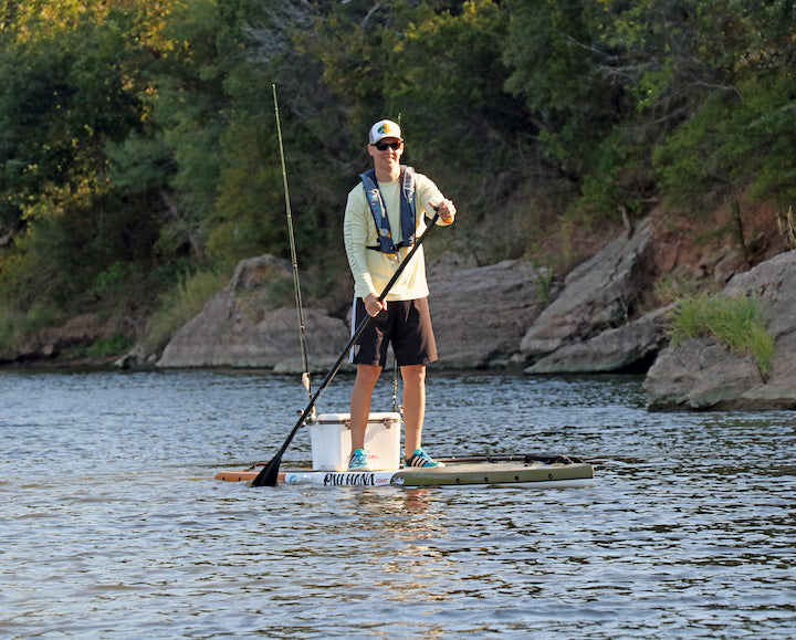 man paddling his fishing SUP