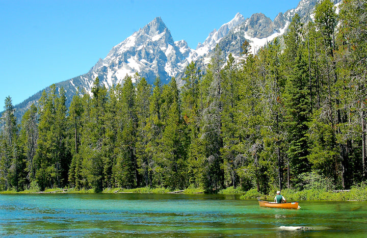 solo canoeist on String Lake, Grand Teton national Park