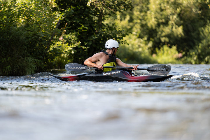 whitewater kayaker in a slice kayak