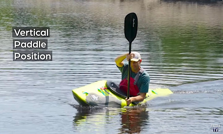 ken whiting demonstrates vertical paddle position when carving a whitewater kayak