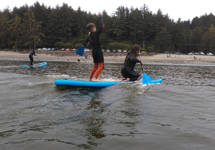 kids on SUP boards learning to surf