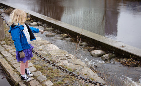 Astrid points out some trash on the banks of the river before heading out on her first packrafting trip