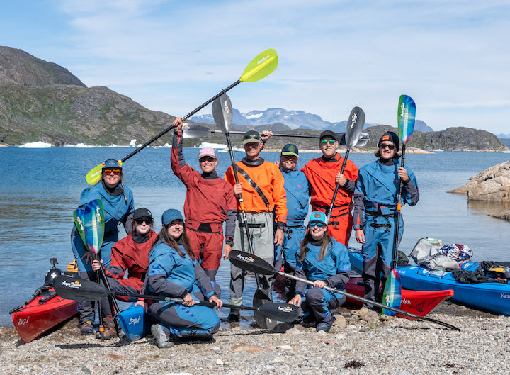 Aqua Bound team members and guides with their kayaks and paddles