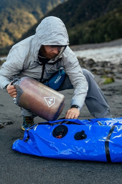 Placing a dry bag into the ISS of a packraft