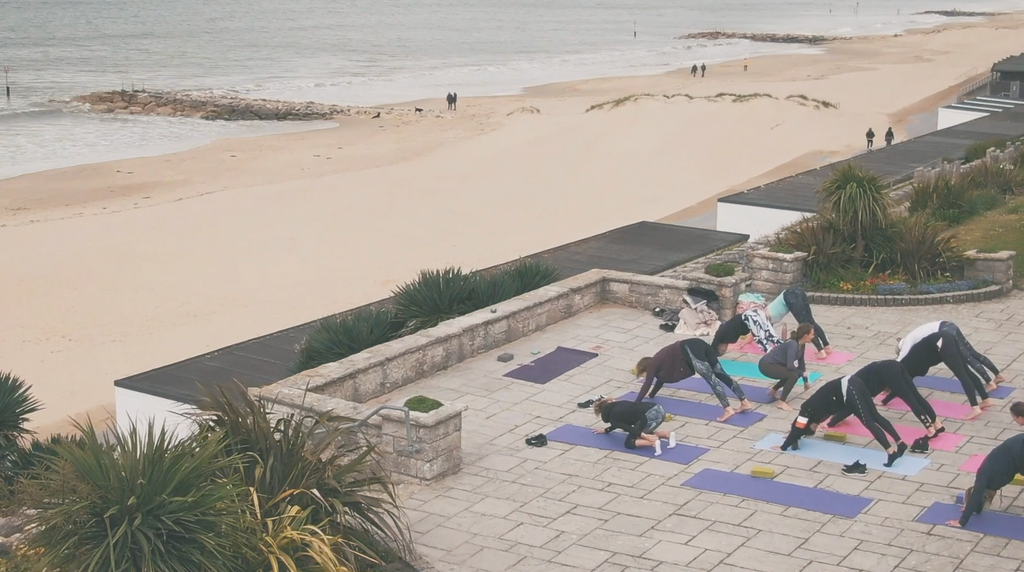 Yoga class by the sea. Exercise