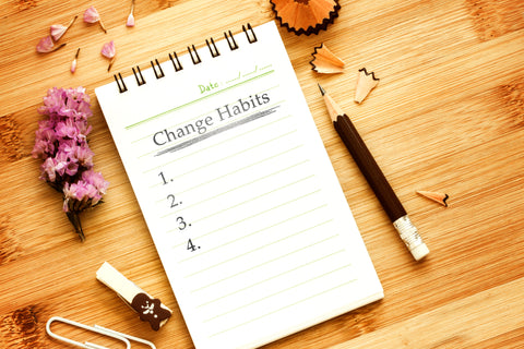 Gesunde Gewohnheiten: Notizblock mit Aufschrift " Change Habits"
