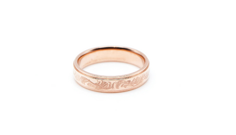 Rose gold wedding band with hand engraving