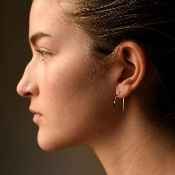 model wearing the half moon threader earrings