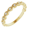 14k yellow gold scalloped band with milgrain details and diamond accents on white background.