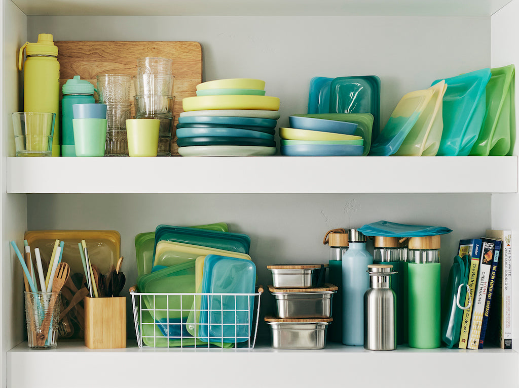 Reusable bags, bottles, and plates on a shelf