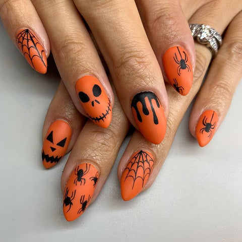 Halloween nail art: scary faces and insects.