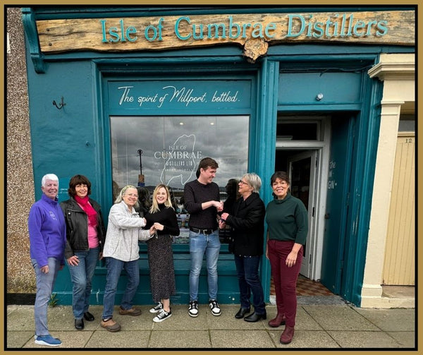 The original Isle of Cumbrae Distillery Team hand over the keys to Caroline and Struan.