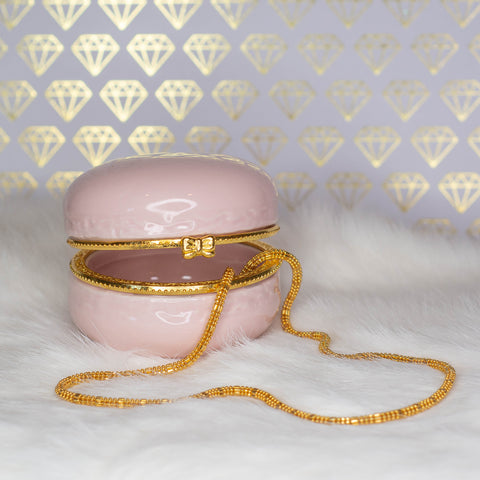 Gold chain necklace in a pink macaron jewelry box