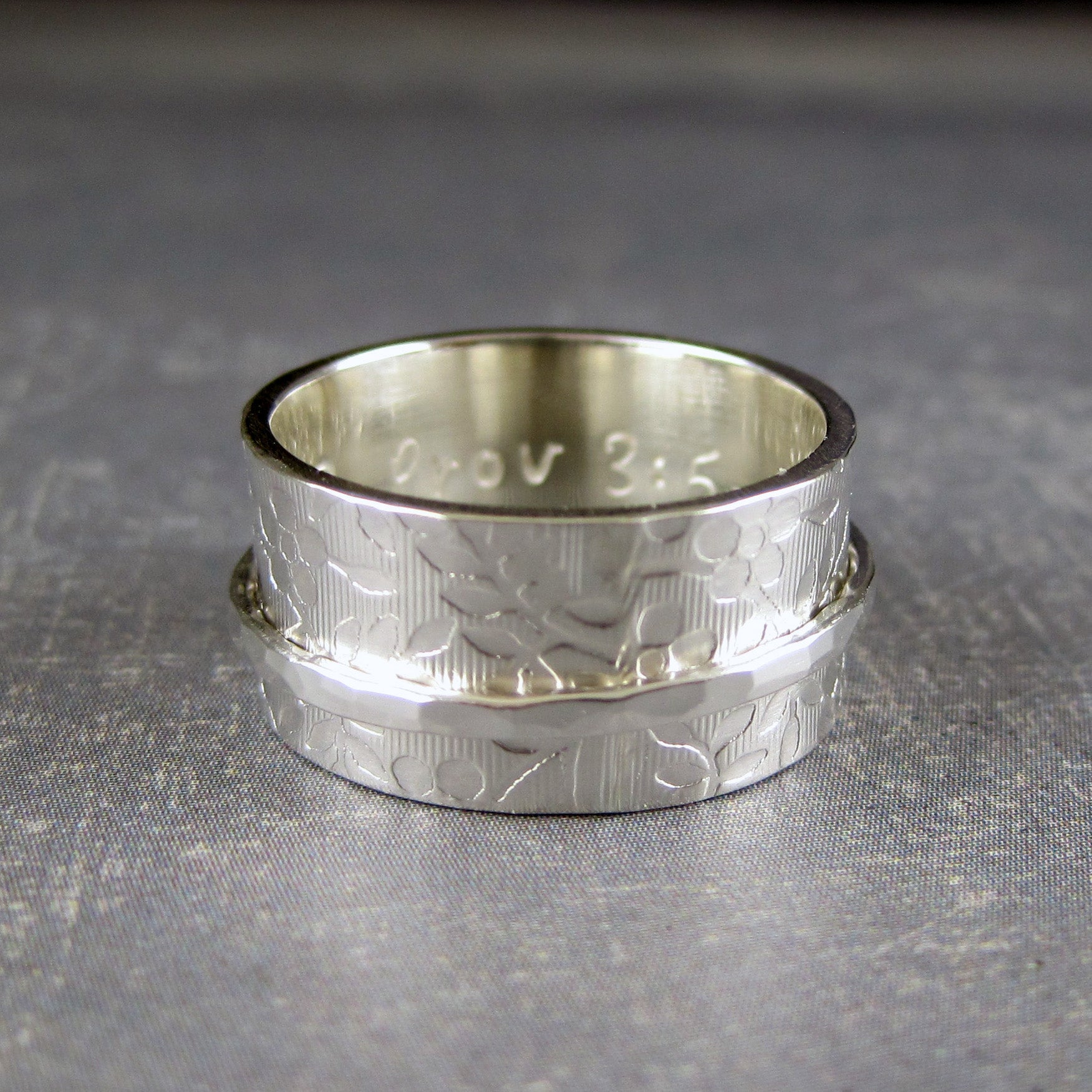 Sterling silver spinner ring in a floral pattern and  personalized with your inscription of choice