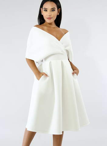 This is an image of a white midi dress that illustrates a portrait neckline as a main design element.