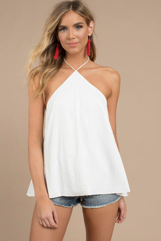 This is an image of a white summer halter top, triangle shape, closing behind your neck, hip length.