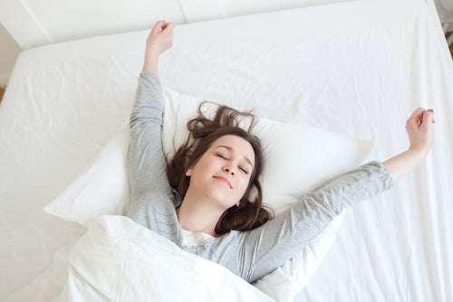 woman waking up rested
